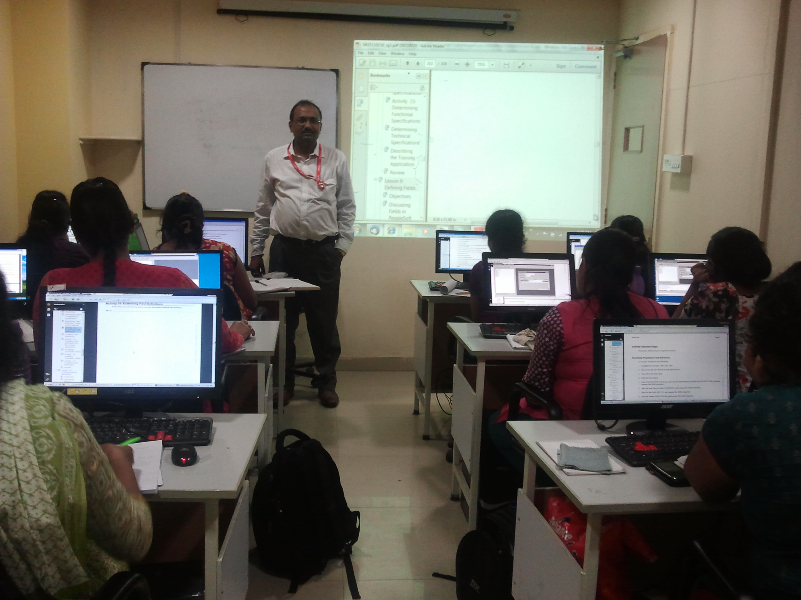 Trainer leading a computer classroom session