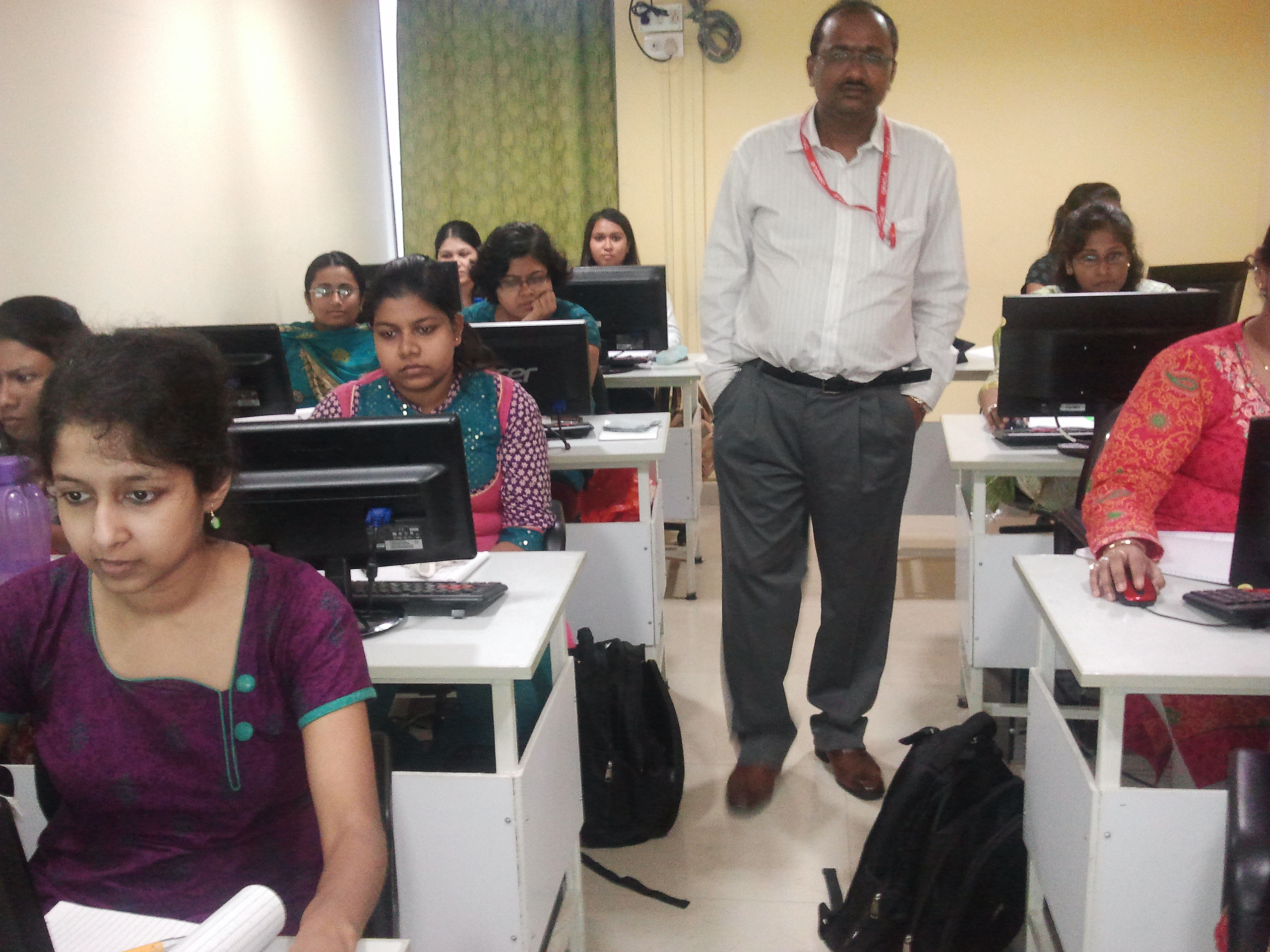 Computer training class with trainer and students